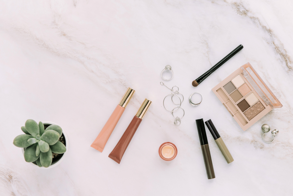makeup and jewelry flat lay on white surface 2026 03 19 06 28 32 utc