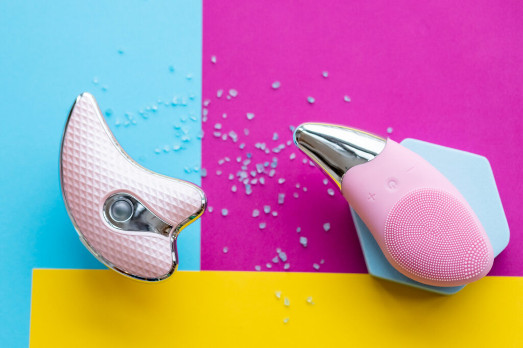 pink skincare tools on a colorful backdrop 2026 03 18 09 54 45 utc