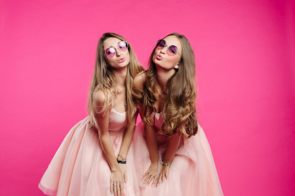 two women in pink dresses pouting in studio 2026 03 19 08 22 40 utc