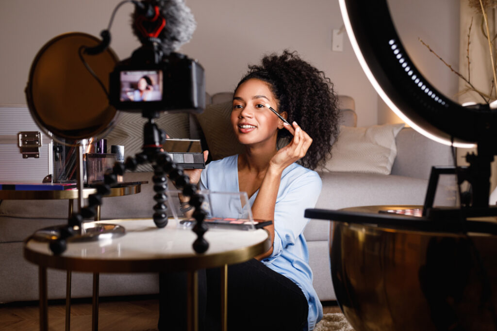 woman recording makeup tutorial in living room 2026 03 19 10 25 51 utc